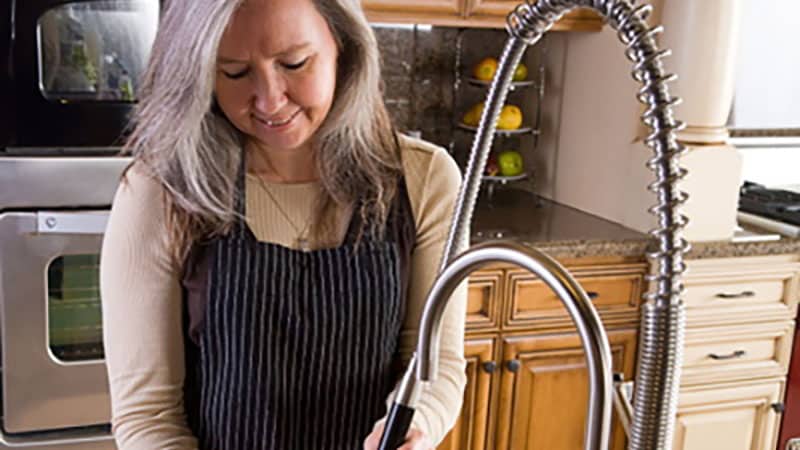 Professional plumber working in Tampa Bay home